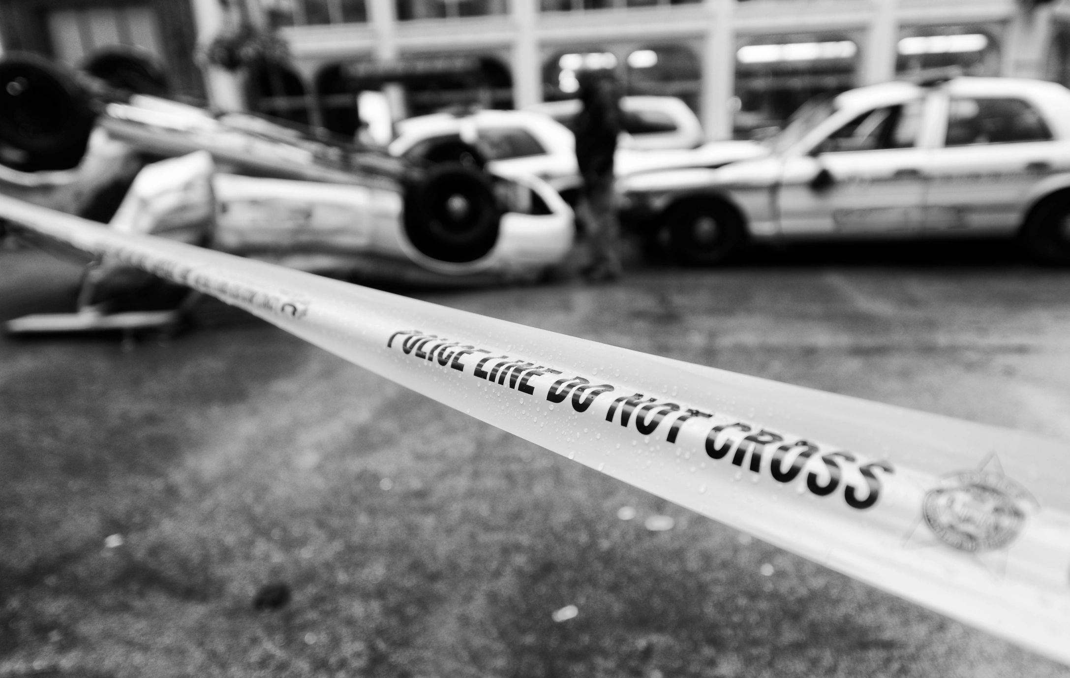 Police tape at a city intersection
