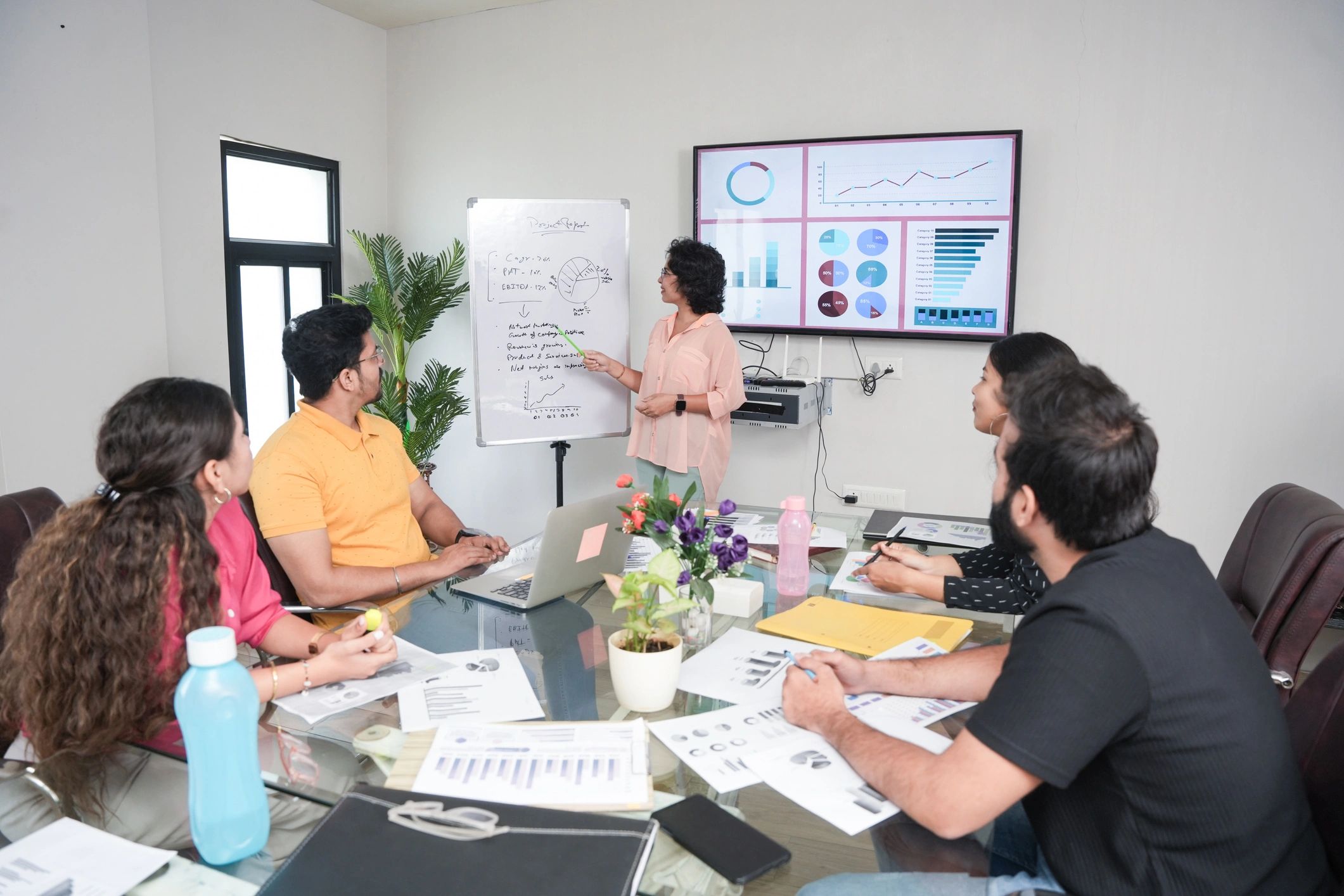 South Asian newsroom team collaborating during an editorial meeting
