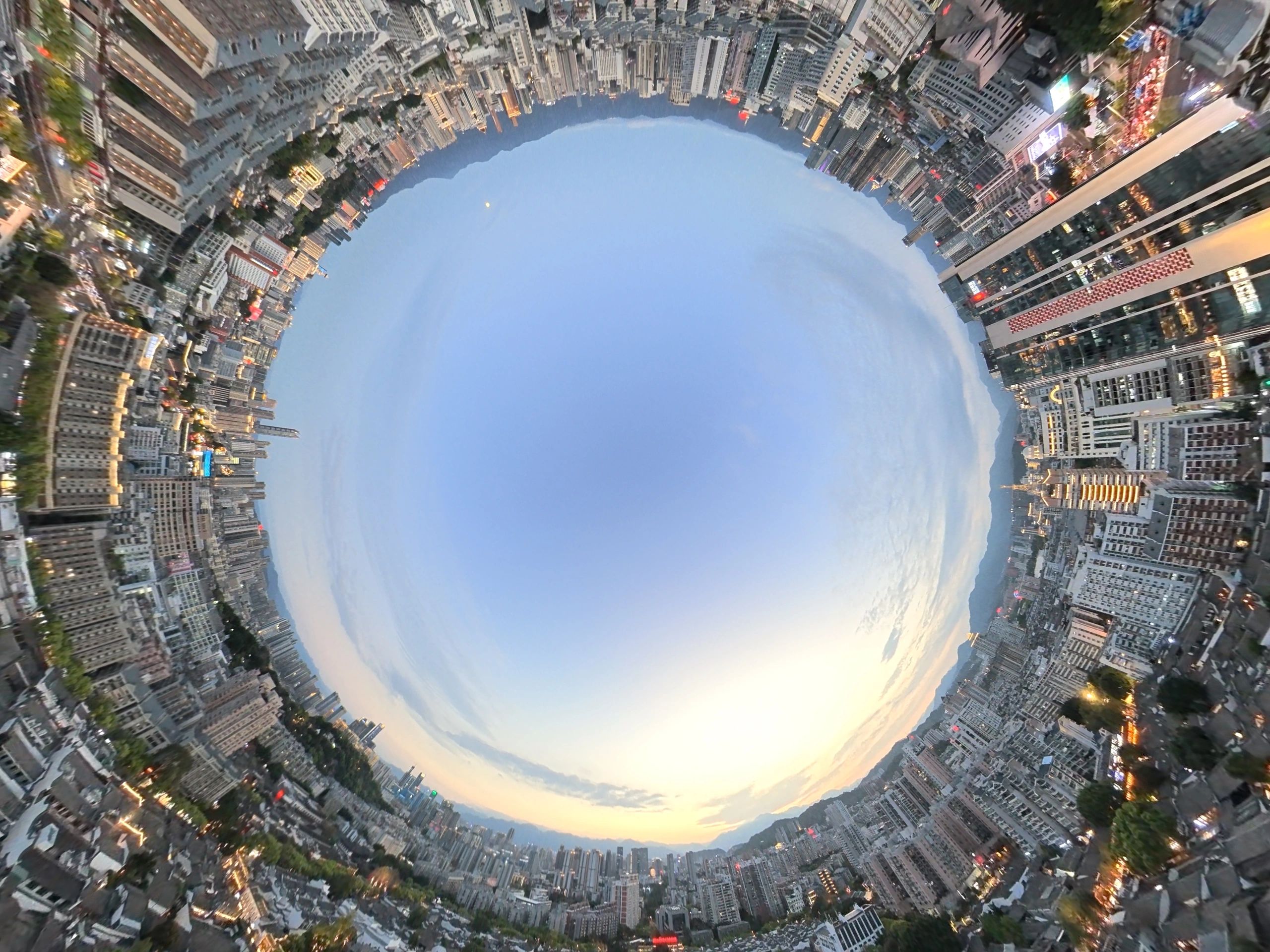 Urban skyline at dusk representing world coverage