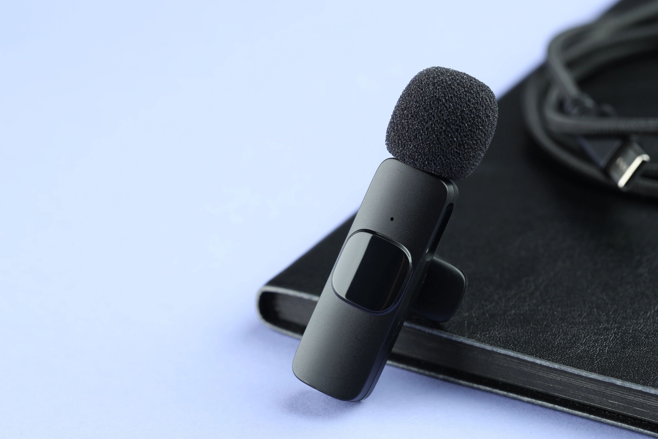 Microphone and notebook representing media partnerships